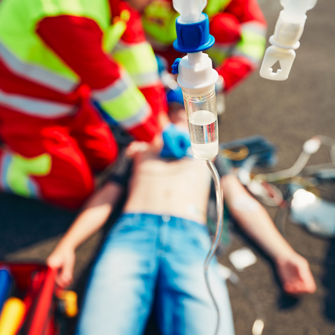 EMT Paramedics performing lifesaving CPR on a boy